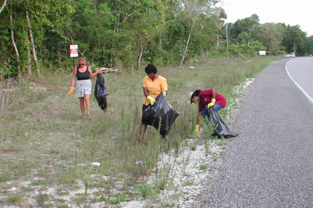 Volunteers Clean-Up Roadside Entrance to Negril - Negril Travel Guide